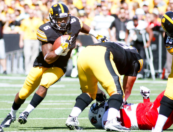 Damon Bullock rushes for the Iowa Hawkeyes.