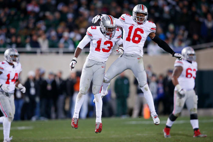 Ohio State players celebrating on the football field.