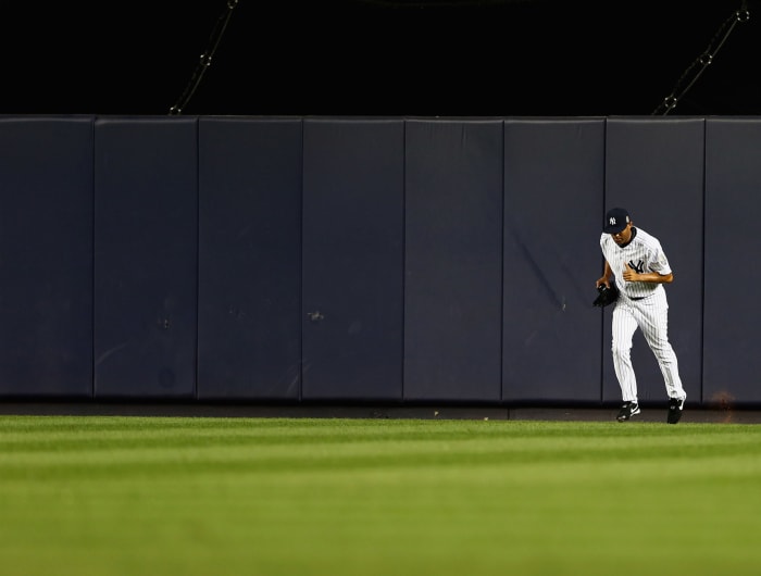 Mariano Rivera jogging onto the field at Yankee Stadium.