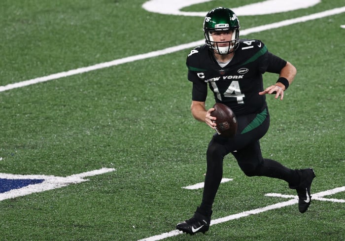 Sam Darnold escapes the pocket during a New York Jets game.