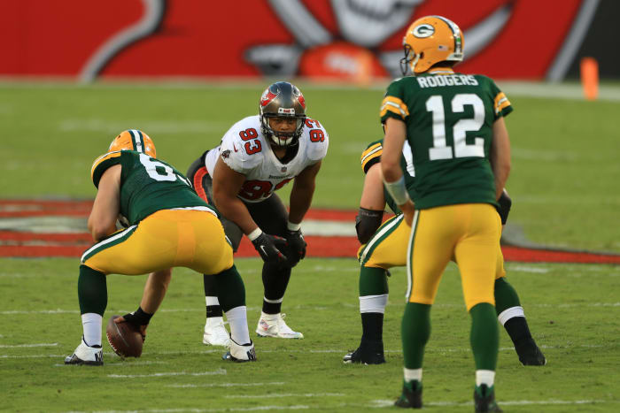 Green Bay Packers quarterback Aaron Rodgers against Ndamukong Suh.