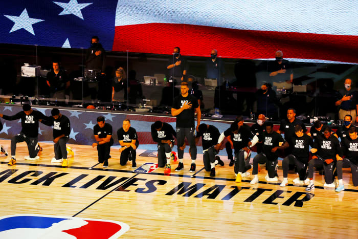 Meyers Leonard stands during the national anthem.
