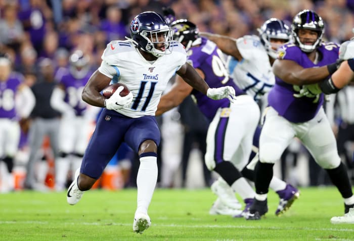 Tennessee Titans wide receiver A.J. Brown carries the ball in an NFL game.