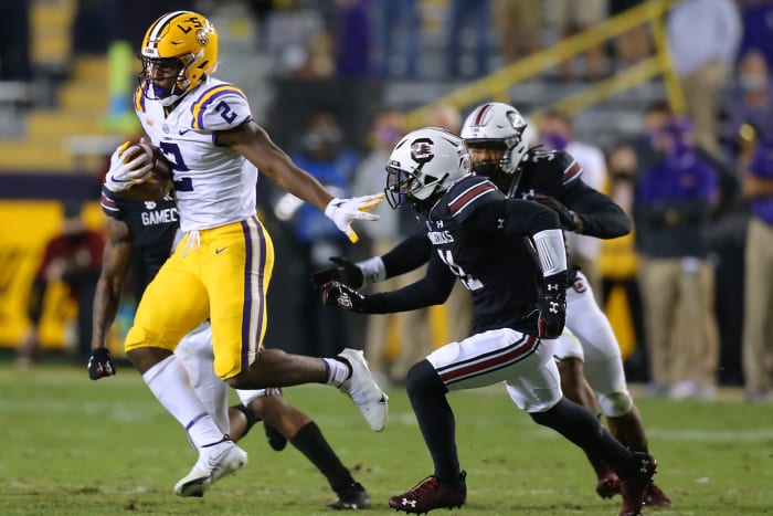 Arik Gilbert avoids a tackle from a South Carolina player.