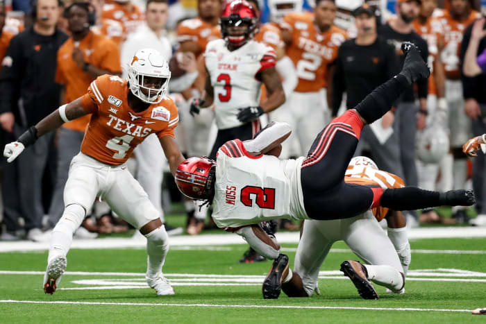 Anthony Cook looks on as Zack Moss gets tackled.