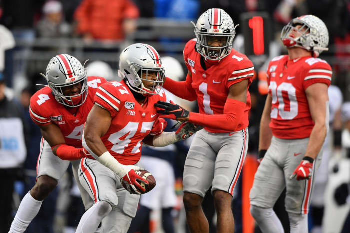 Ohio State linebacker Justin Hilliard celebrates on the field.