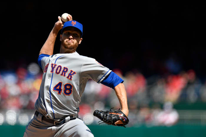 Jacob deGrom throwing a pitch.