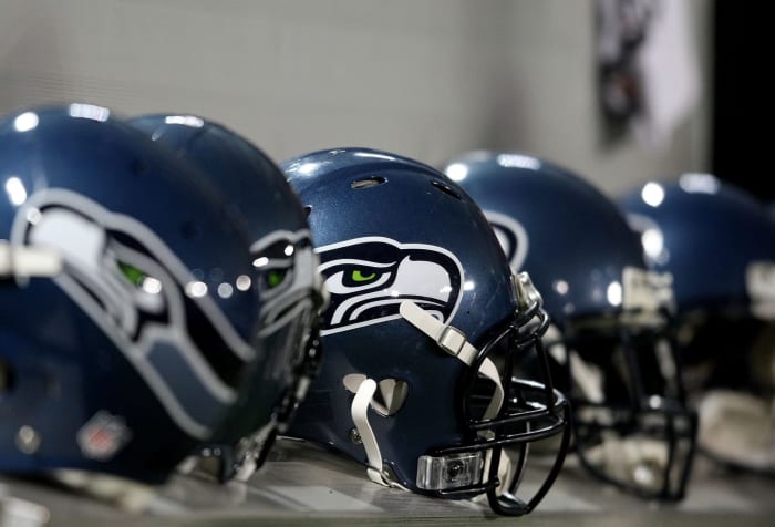 Seattle Seahawks helmets on the sideline.