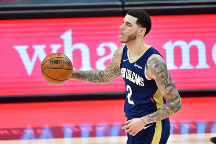 Pelicans PG Lonzo Ball dribbles the ball up the court.