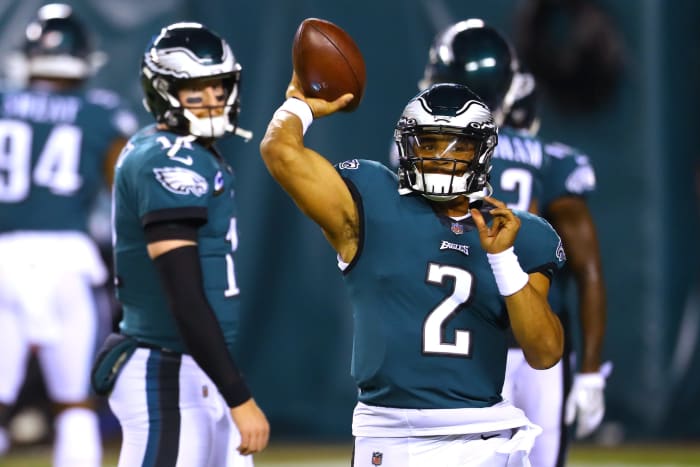 Philadelphia Eagles QB Carson Wentz watches Jalen Hurts throwing a pass in pregame warmups.