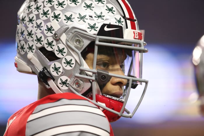 Ohio State quarterback Justin Fields, a Big Ten football star, on the field.