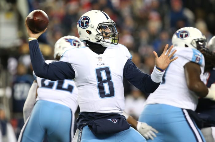 Marcus Mariota, now with the Las Vegas Raiders after leaving the Tennessee Titans, winding up to throw a pass.