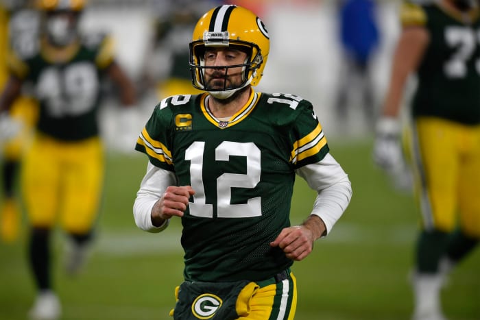 Quarterback Aaron Rodgers #12 of the Green Bay Packers warms up prior to the game against the Carolina Panthers