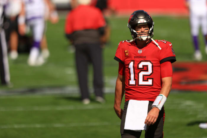 Tom Brady #12 of the Tampa Bay Buccaneers warms up before their game against the Minnesota Vikings