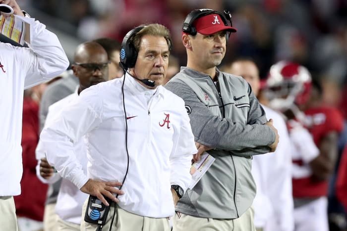 Head coach Nick Saban (L) and offensive coordinator Steve Sarkisian of the Alabama Crimson Tide stand on the sideline