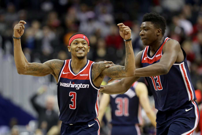Bradley Beal #3 of the Washington Wizards celebrates with Thomas Bryant #13 after hitting a three pointer
