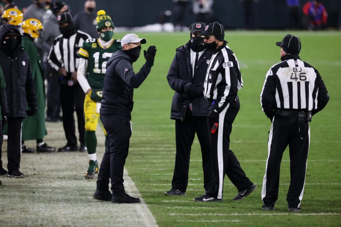 Green Bay Packers coach Matt LaFleur arguing with referees after a questionable pass interference call in the NFC Chapionship.