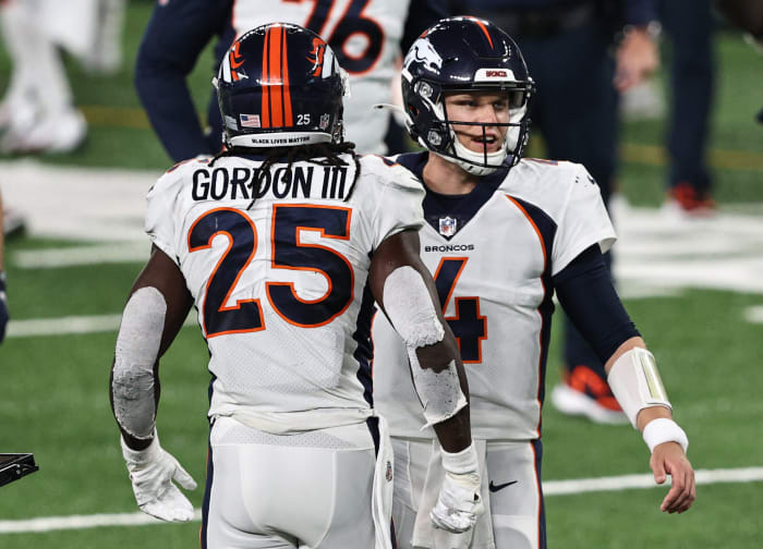 Brett Rypien celebrating with Melvin Gordon.