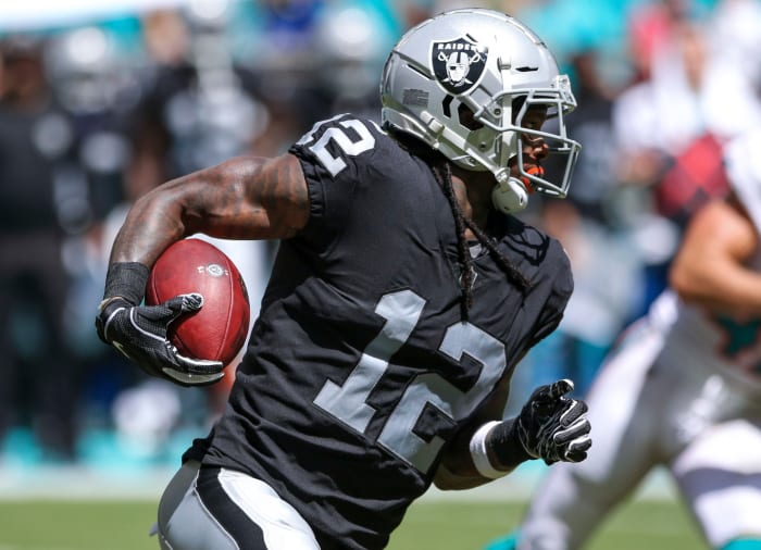 Martavis Bryant carrying the football during a game with the Raiders