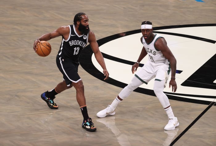 James Harden dribbling up the court for the Nets.
