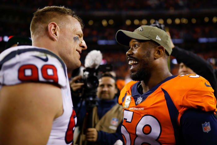 Denver Broncos star Von Miller and Houston Texans star JJ Watt after a game.