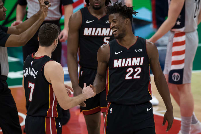 Jimmy Butler celebrates with teammates.