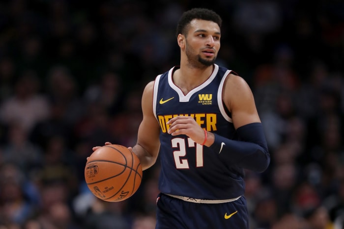 Jamal Murray dribbling up the floor for the Denver Nuggets.