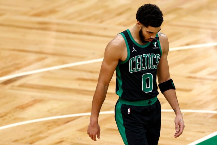 Jayson Tatum walking off the court.