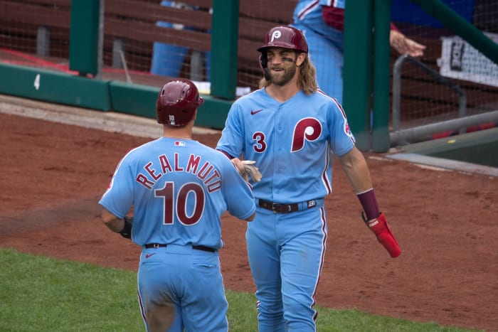 J.T. Realmuto celebrates with Bryce Harper.