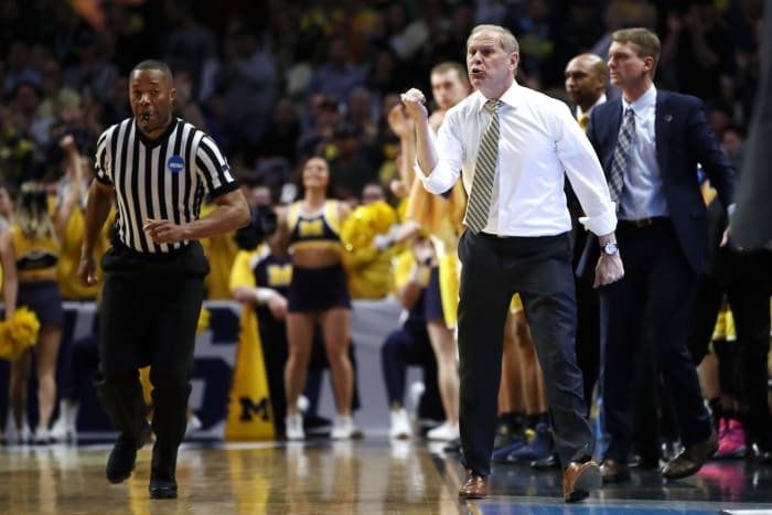 Michigan basketball head coach John Beilein on the sideline during an NCAA Tournament game.