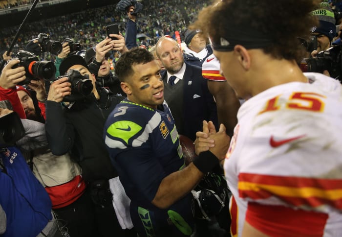 Seattle Seahawks QB Russell Wilson shakes hands with NFL MVP Patrick Mahomes of the Kansas City Chiefs.