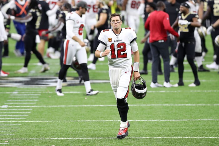 Tom Brady trots off the field after his first game with the Bucs.