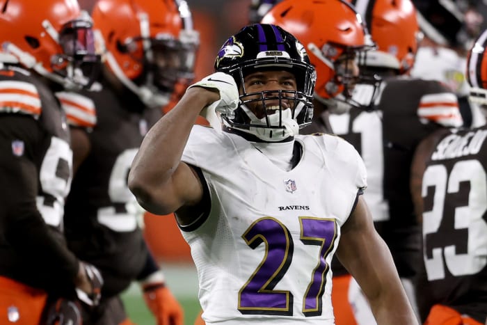 Ravens running back JK Dobbins flexes during a game.
