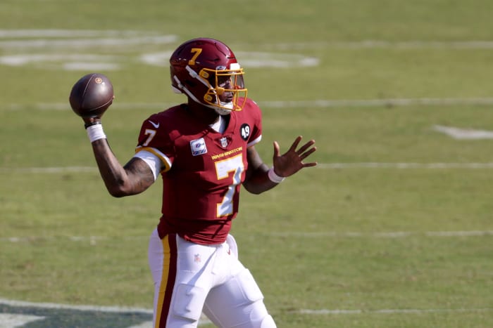 Dwayne Haskins throws the football for Washington.