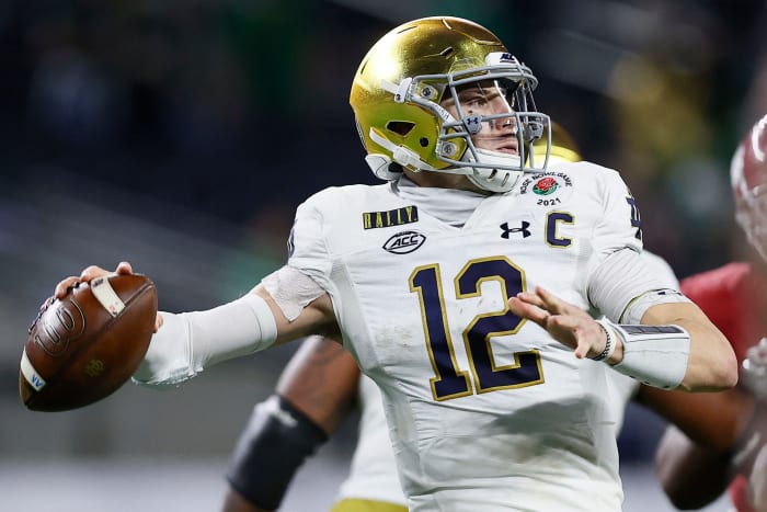 Quarterback Ian Book #12 of the Notre Dame Fighting Irish drops back to pass