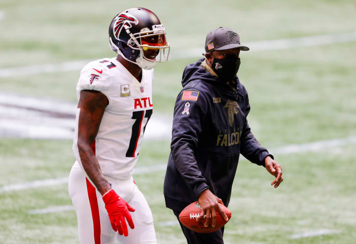 Raheem Morris on the field with Julio Jones.