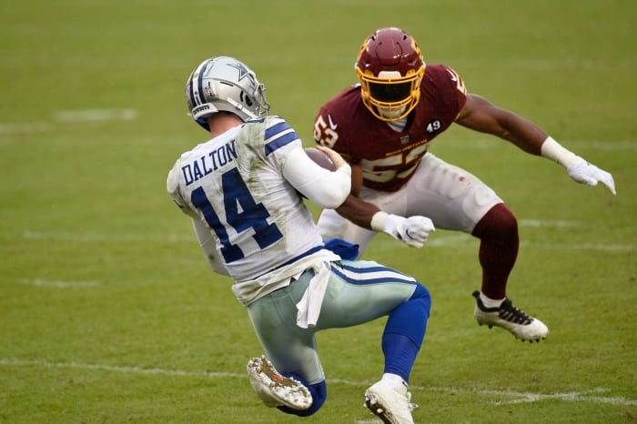 Washington Football Team linebacker Jon Bostic hits Andy Dalton.