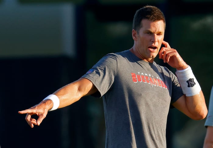 Tom Brady instructs his Buccaneers teammates.