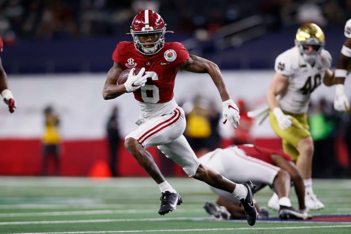 Wide receiver DeVonta Smith #6 of the Alabama Crimson Tide carries the ball for a touchdown