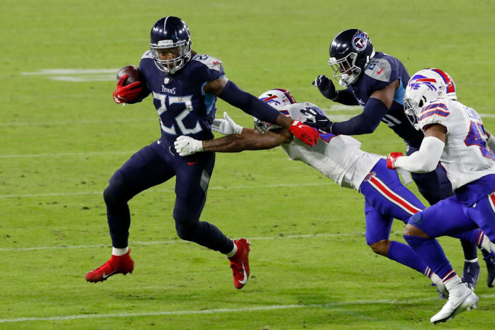 Derrick Henry attempts to escape a tackle.