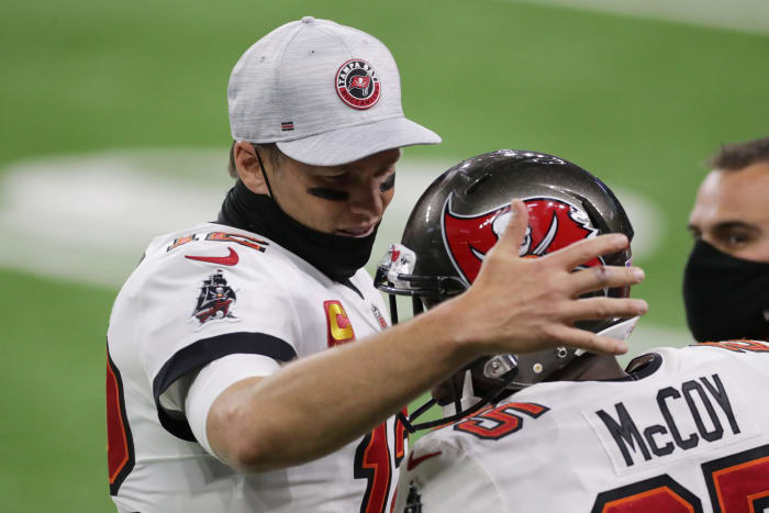 Veterans Tom Brady and LeSean McCoy celebrate after the Super Bowl.