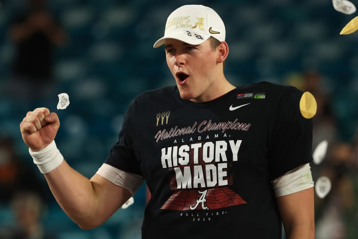 Mac Jones #10 of the Alabama Crimson Tide celebrates after winning the national championship. He's a New England Patriots rookie in 2021.