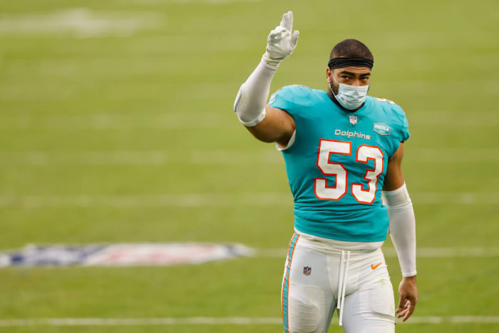 Miami Dolphins linebacker Kyle Van Noy acknowledges the crowd walking off the field.