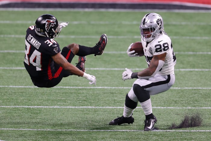 Josh Jacobs runs through Atlanta defender
