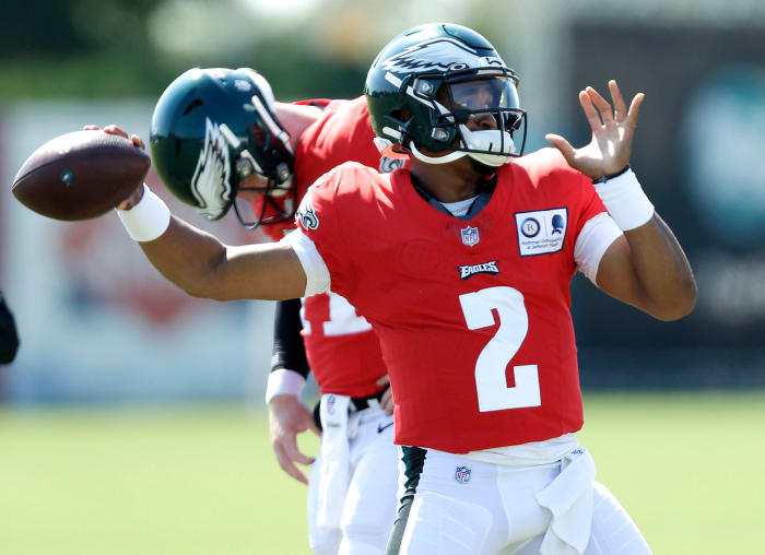 Jalen Hurts throwing at training camp.