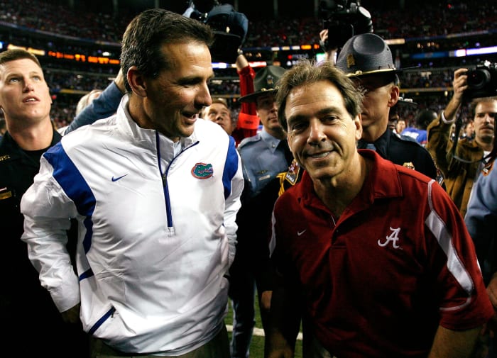 Head coach Nick Saban of the Alabama Crimson Tide congratulates head coach Urban Meyer of the Florida Gators.