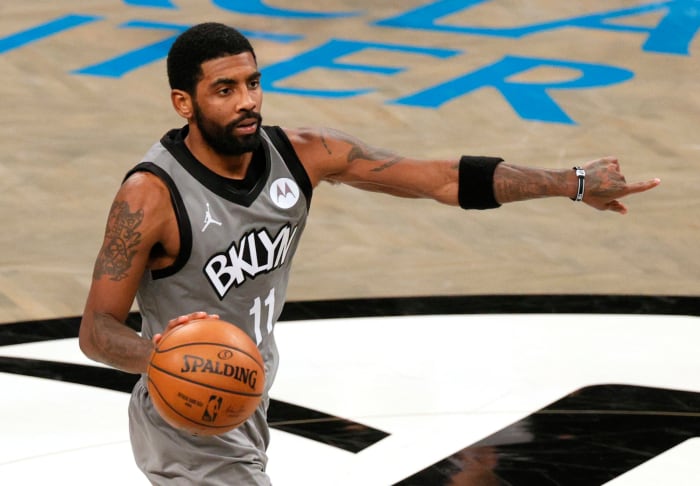Kyrie Irving dribbling for the Nets.