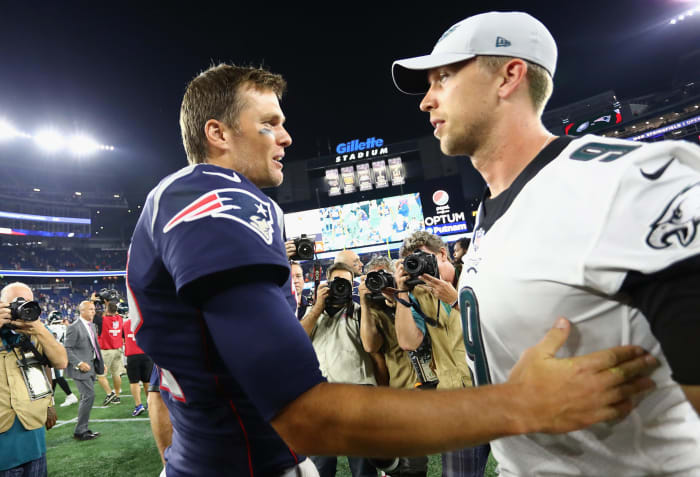 Tom Brady and Nick Foles shake hands.