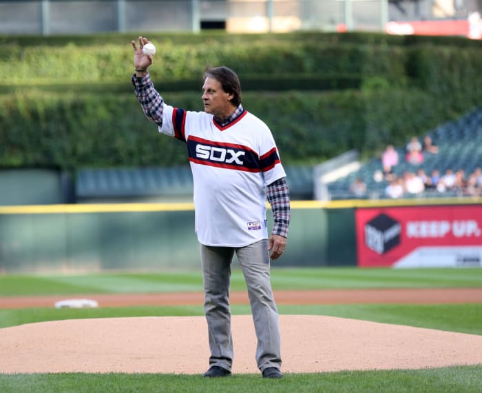 Tony LaRussa waves at the crowd before throwing out first pitch in a Chicago White Sox jersey.