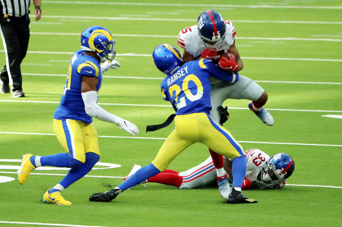 Jalen Ramsey tackles Golden Tate in a game.